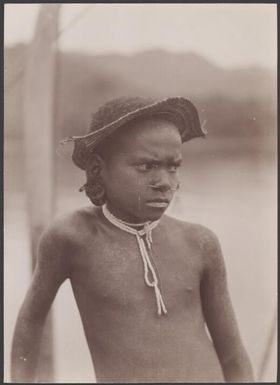 A boy of Vella Lavella wearing sunshade, Solomon Islands, 1906 / J.W. Beattie