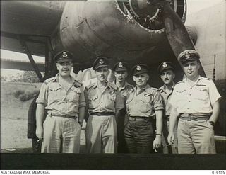 New Guinea. 1944-02-20. RAAF members are now flying American Liberator aircraft operating in New Guinea. Every state except Tasmania is represented in the Liberator crews. Left to right: Flying ..