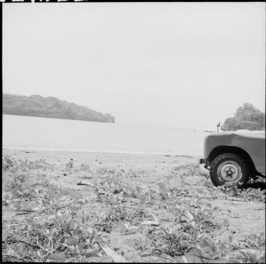 A jeep parked on a beach, Vanuatu, 1969 / Michael Terry