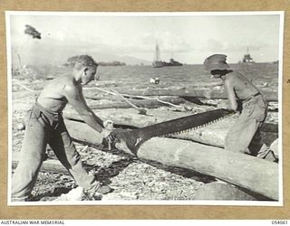 MILNE BAY, NEW GUINEA, 1943-07-12. VX106377 SAPPER S.N. ANDERSON (LEFT) AND V256226 SAPPER F.R. SMITH (RIGHT), BOTH OF NO. 2 SECTION, 4TH AUSTRALIAN FIELD COMPANY, ROYAL AUSTRALIAN ENGINEERS, ..