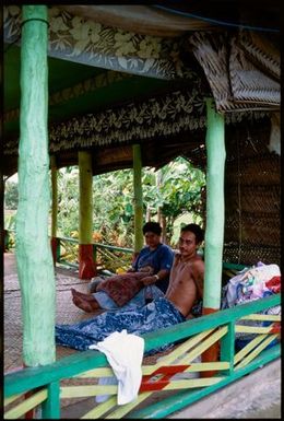 Two people in a fale (house), Samoa