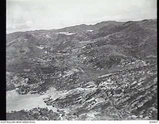 PORT MORESBY, PAPUA. 1932-09-17. AERIAL VIEW OF THE PRIMITIVE AERODROME, FACING NORTH WEST. (NAVAL HISTORICAL COLLECTION)