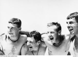 NEW GUINEA. 28 FEBRUARY 1944. AUSTRALIANS WHO ADVANCED ALONG THE COAST TO LINK UP WITH THE AMERICANS AT SAIDOR STAGED AN IMPROMPTU SURF CARNIVAL ON THEIR FIRST FREE DAY. THE TROOPS GET PLENTY OF ..