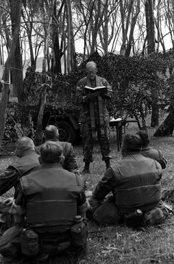 Marines of the 1ST Amphibious Brigade attend a Protestant religious service lead by US Navy Chaplain, Captain (CPT) W.B. Turner