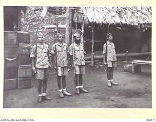 KUMUIA YAMA, RABAUL AREA, NEW BRITAIN. 1945-09-17. INDIAN TROOPS PLACE THEIR FIRST QUARTER GUARD SINCE PEACE AT THE INDIAN PRISONER OF WAR CAMP. ALTHOUGH THEY HAD ONLY STICKS AS WEAPONS THIS GUARD ..