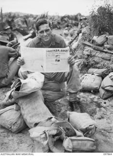 BORAM BEACH, NEW GUINEA. 1945-10-13. THE FIRST BATCH OF TROOPS TO LEAVE THE WEWAK AREA UNDER THE PRIORITY DEMOBILISATION SCHEME WERE MEMBERS OF 6 DIVISION. SHOWN, WARRANT OFFICER 2 J.L. ARMISTEAD ..