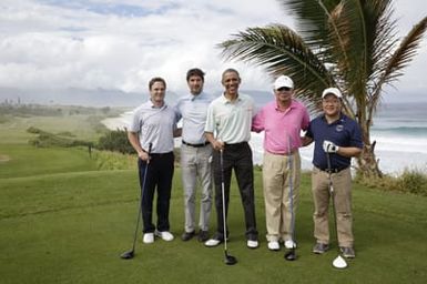Barack Obama plays golf with Prime Minister Najib Razak, Joe Paulsen, and Mike Brush in Kaneohe Bay, Hawaii, December 24, 2014