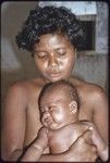 Young women holding a baby