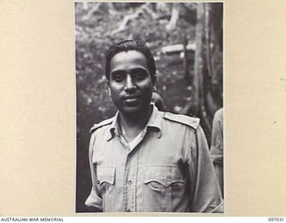 KURURAI YAMA, NEW BRITAIN. 1945-09-17. LIEUTENANT H.K. DAS, A LIBERATED OFFICER AT THE INDIAN PRISONER OF WAR CAMP. HE CONTINUALLY PROTECTED HIS TROOPS WHEN THEY WERE CAUGHT STEALING RATIONS AND ..