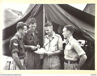 BORAM BEACH, WEWAK AREA, NEW GUINEA. 1945-08-31. PERSONNEL OF WARD 2, 2/15 FIELD AMBULANCE. IDENTIFIED PERSONNEL ARE:- CORPORAL N.J. STRAY (1); PRIVATE F.W. MIDOLA (2); CAPTAIN W.P. HARRIS (3); ..