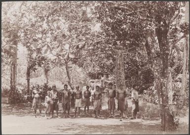 Men from Mota at the entrance to their village, Banks Islands, 1906 / J.W. Beattie