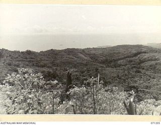 FINSCHHAFEN AREA, NEW GUINEA, 1944-03-17. VIEWED SOUTH SOUTH EAST FROM FOUGASSE CORNER, PICTURING SISI VILLAGE TO THE LEFT, KUMAWA AND FINSCHHAFEN TO THE RIGHT IN THE BACKGROUND