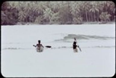 Boys in canoes