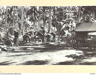 SIAR, NEW GUINEA. 1944-06-25. A GENERAL VIEW OF THE AREA OCCUPIED BY NO.12 PLATOON, B COMPANY, 57/60TH INFANTRY BATTALION. IDENTIFIED PERSONNEL ARE:- VX140427 PRIVATE W.G. HOWARD (1); VX135957 ..