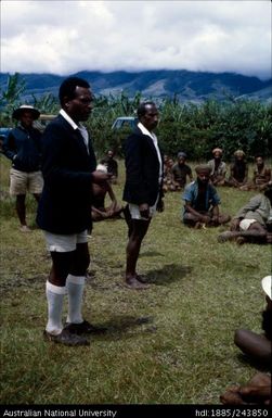 Men wearing uniform addressing a group