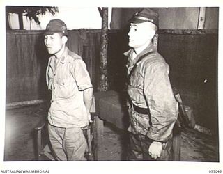 TOKO, BOUGAINVILLE. 1945-08-18. FIRST CONTACT BETWEEN JAPANESE SURRENDER ENVOY AND AUSTRALIAN TROOPS ON BOUGAINVILLE. SHOWN THE JAPANESE PARTY WAITING IN THE ANTE ROOM AT HQ 3 DIVISION. IDENTIFIED ..