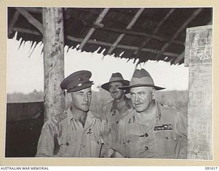 NADZAB, NEW GUINEA, 1945-05-11. GENERAL SIR THOMAS A. BLAMEY, COMMANDER IN CHIEF, ALLIED LAND FORCES, SOUTH WEST PACIFIC AREA (1), WITH THE BANDMASTER, LIEUTENANT J. RYDER (2), AND LIEUTENANT ..