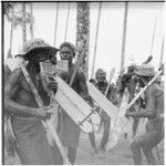 Re-enactment of a men's feast dance