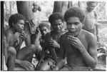 Playing 'aubinubin, or'aukwa'ikwa'i, panpipes