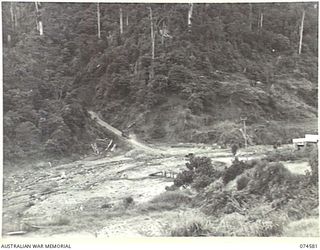 NEW GUINEA. 1944-07-09. A SECTION OF THE NEW WAU-BULLDOG ROAD WHERE IT CROSSES EDIE CREEK