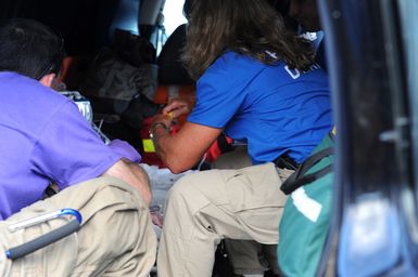 Earthquake ^ Tsunami - Pago Pago, American Samoa, October 5, 2009 -- Members of a Disaster Medical Assistance Team (DMAT) prepare to transfer an infant to a Coast Guard plane that will evacuate the infant to Hawaii. DMATs are part of the U. S. Department of Health and Human Services' National Disaster Medical System which supports hospitals and other medical and public health needs of communities during disasters such as the earthquake and tsunami disaster in American Samoa. FEMA/Casey Deshong