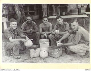 NAURU ISLAND. 1945-10-02. MEMBERS OF D COMPANY, 31/51 INFANTRY BATTALION OCCUPATION FORCE, ON COOKHOUSE FATIGUE PEELING VEGETABLES. IDENTIFIED PERSONNEL ARE:- PRIVATE A.J. PREUSKER (1); PRIVATE W. ..