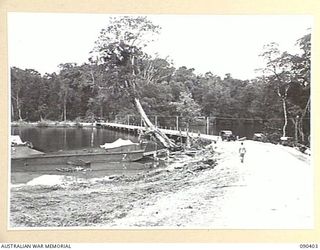 JACQUINOT BAY, NEW BRITAIN. 1945-04-08. BUILT BY 4 FIELD COMPANY, ROYAL AUSTRALIAN ENGINEERS, THIS CLASS 12 PILE BRIDGE WAS ERECTED OVER THE TAUT RIVER IN THE RECORD TIME OF 16 DAYS. THE BRIDGE IS ..