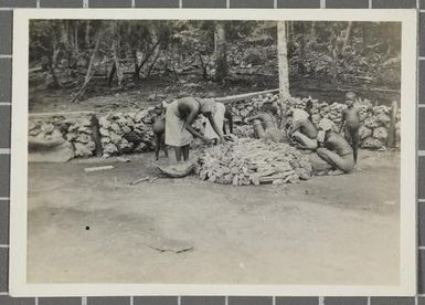 Nissan women building their cooking fire