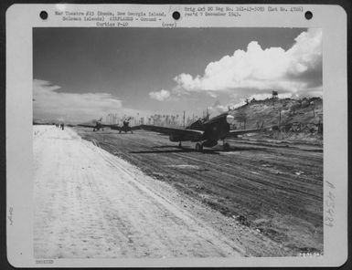 Curtiss P-40S Land At Munda Field, New Georgia Island, Solomon Islands After It Was Captured By The American Forces. 14 August 1943. (U.S. Air Force Number 79813AC)