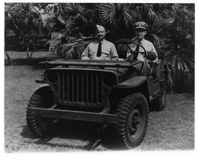 Military personnel in jeep