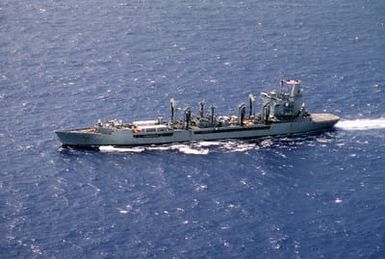 An aerial port side view of the fleet oiler USS WILLIAMETTE (AO-180) underway near Hawaii