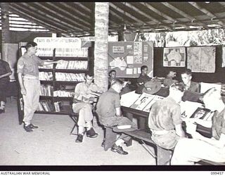 RABAUL, NEW BRITAIN, 1945-12-17. THE AUSTRALIAN ARMY EDUCATION SERVICE LIBRARY, WITH ITS VERY COMPREHENSIVE SUPPLY OF LITERATURE, AT 16TH INFANTRY BATTALION