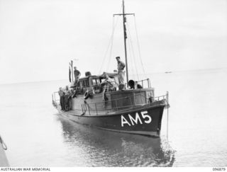 VUNAPOPE, NEW BRITAIN, 1945-09-16. THE 62-FT MOTOR LAUNCH GLORIA, AM5, 16 SMALL SHIPS COMPANY, WHICH, WITH AN ARMY LANDING BARGE EVACUATED SISTERS AND PRIESTS FROM RAMALE VALLEY INTERNMENT CAMP. ..