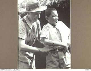 1943-03-15. NEW GUINEA. HALF NAKED AND RAVENOUSLY HUNGRY THIS COOLIE, AGED 13, WANDERED INTO THE AUSTRALIAN LINES NEAR WAU. HE WAS PLACED IN AN AUSTRALIAN HOSPITAL SOMEWHERE IN NEW GUINEA, AND ..