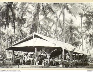 ALEXISHAFEN NORTH, NEW GUINEA. 1944-09-01. THE NEW MEDICAL WARD AT THE MEDICAL DRESSING STATION AT THE 2/15TH FIELD AMBULANCE. IDENTIFIED PERSONNEL ARE:- SX14526 PRIVATE J. FLETCHER (1); QX30637 ..