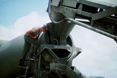 Navy Seabees from Navy Mobile Construction Battalion Four (NMCB-4) pour cement at Apra Harbor. The facilities are being expanded due to the relinquishing of the Subic Bay Naval Base. (Exact Date Shot Unknown)