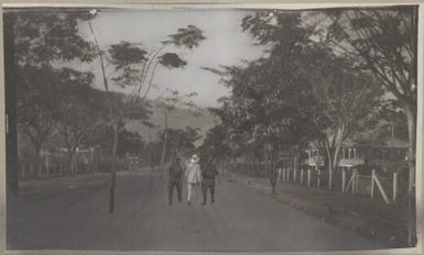 Two soldiers and a civilian walking down the road, Rabaul, New Guinea, 1914