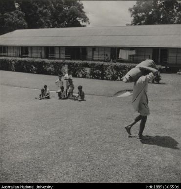 Children seated on the grass