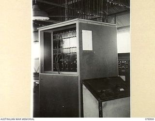 LAE, NEW GUINEA. 1945-02-06. AERIAL PATCH PANEL OF THE WIRELESS TRANSMITTING CENTRE, 19TH LINES OF COMMUNICATION SIGNALS, HEADQUARTERS, FIRST AUSTRALIAN ARMY SHOWING TRANSMISSION LINES OUT AND INTO ..