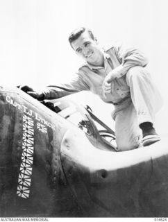 1943-04-12. NEW GUINEA. NINE JAPANESE FLAGS, ONE FOR EACH ENEMY PLANE HE HAS SHOT DOWN IN NEW GUINEA, ARE PAINTED ON THE P38 FIGHTER PILOTED BY CAPTAIN THOMAS J. LYNCH. LYNCH'S DECORATIONS INCLUDE ..