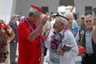 A U.S. Navy Sailor, U.S. Pacific Fleet Band, sounds"Taps"during a joint Navy/National Park Service ceremony commemorating the 65th Anniversary of the attack on Pearl Harbor on Dec. 7, 2006, at Pearl Harbor, Hawaii. More than 1,500 Pearl Harbor survivors, their families and their friends from around the nation joined the more than 2,000 distiguished guests and the general public for the annual observance. (U.S. Navy photo by Mass Communication SPECIALIST 1ST Class James E. Foehl) (Released)