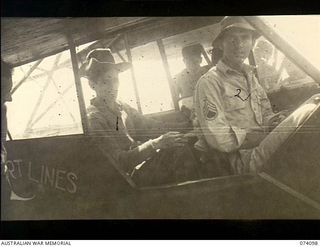 Dugumur Bay, New Guinea. 1944-06-14. Suphdev Singh, Royal Indian Army Service Corps (1), seated in a Piper Cub aircraft of the United States Army Air Corps which is to fly him out of Senai 2 to ..