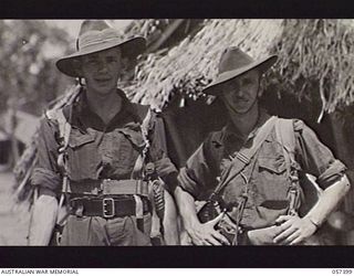 PORT MORESBY, NEW GUINEA. 1943-09-14. LIEUTENANT W. SANDERS (LEFT) AND LANCE SERGEANT N. STUCKEY, BOTH OF THE MILITARY HISTORY SECTION