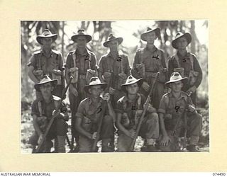 MADANG, NEW GUINEA. 1944-07-03. BATMEN OF BATTALION HEADQUARTERS, 24TH INFANTRY BATTALION. IDENTIFIED PERSONNEL ARE:- PRIVATE J. HAYES (1); PRIVATE F. SIMON (2); PRIVATE F. RYAN (3); PRIVATE G.D. ..