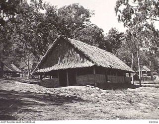 KOITAKI, NEW GUINEA. 1943-07-13. EXTERIOR VIEW OF THE AUSTRALIAN ARMY EDUCATION SERVICE HEADQUARTERS, NEW GUINEA FORCE