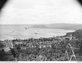 RABAUL, NEW BRITAIN, 1946-04-03. A PANORAMIC VIEW FROM OBSERVATORY HILL LOOKING SOUTH SOUTH WEST, SHOWING THE BUILDINGS OF 2 BASE SUPPLY DEPOT