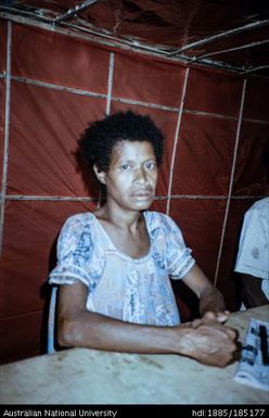 Woman in Bulesi Camp recording her susu history (tetera)