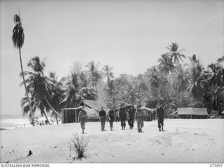 HANSA BAY AREA, NEW GUINEA. 1944-09-05. A SECTION OF THE CAMP AREA OF D COMPANY, 25TH INFANTRY BATTALION NEAR BOIKULU. IDENTIFIED PERSONNEL ARE:- PRIVATE C. EHRLICH (1); Q103279 PRIVATE S.A. FULLER ..