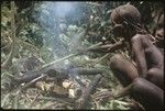 Mamaniageni and old Boori'au cooking in some bamboos