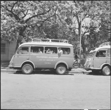 Tour buses parked on side of road, Noumea, New Caledonia, 1967 / Michael Terry